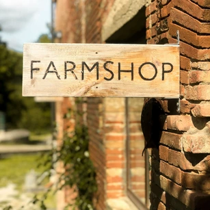 Rustic farm shop sign in the West Country